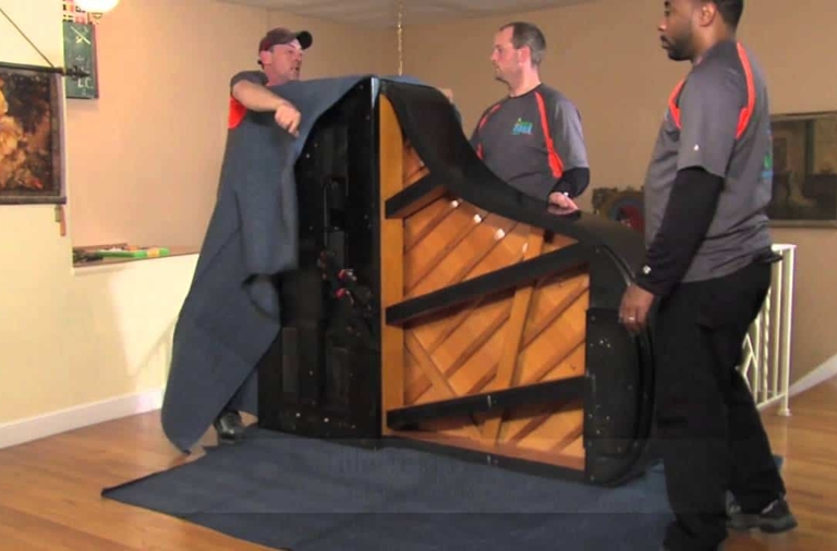 Piano removalists with a grand piano